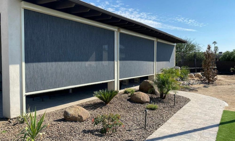 <span class="uk-h4">Outdoor view of a patio with Progressive Screens motorized patio shades.</span>