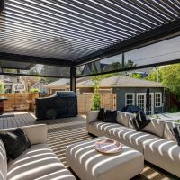 An outdoor patio featuring outdoor shades from Progressive Screens