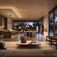 Lutron D2 downlights in an open-concept kitchen and dining area. A modern chandelier hangs above the table.