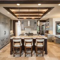 DMF Lighting in-ceiling and pendant fixtures in a large kitchen area with gray cabinets.